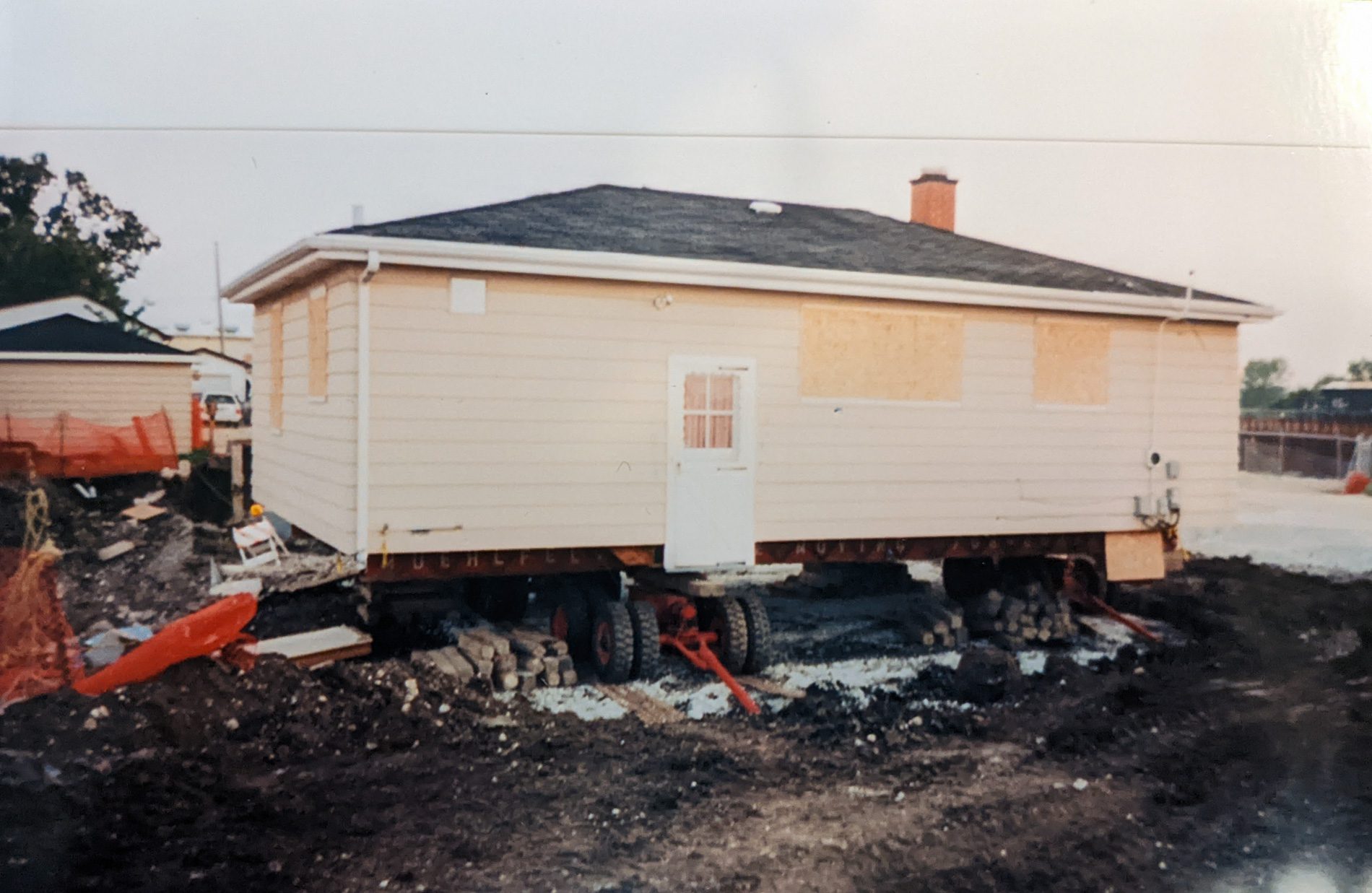 A house jacked up with a pit dug around it