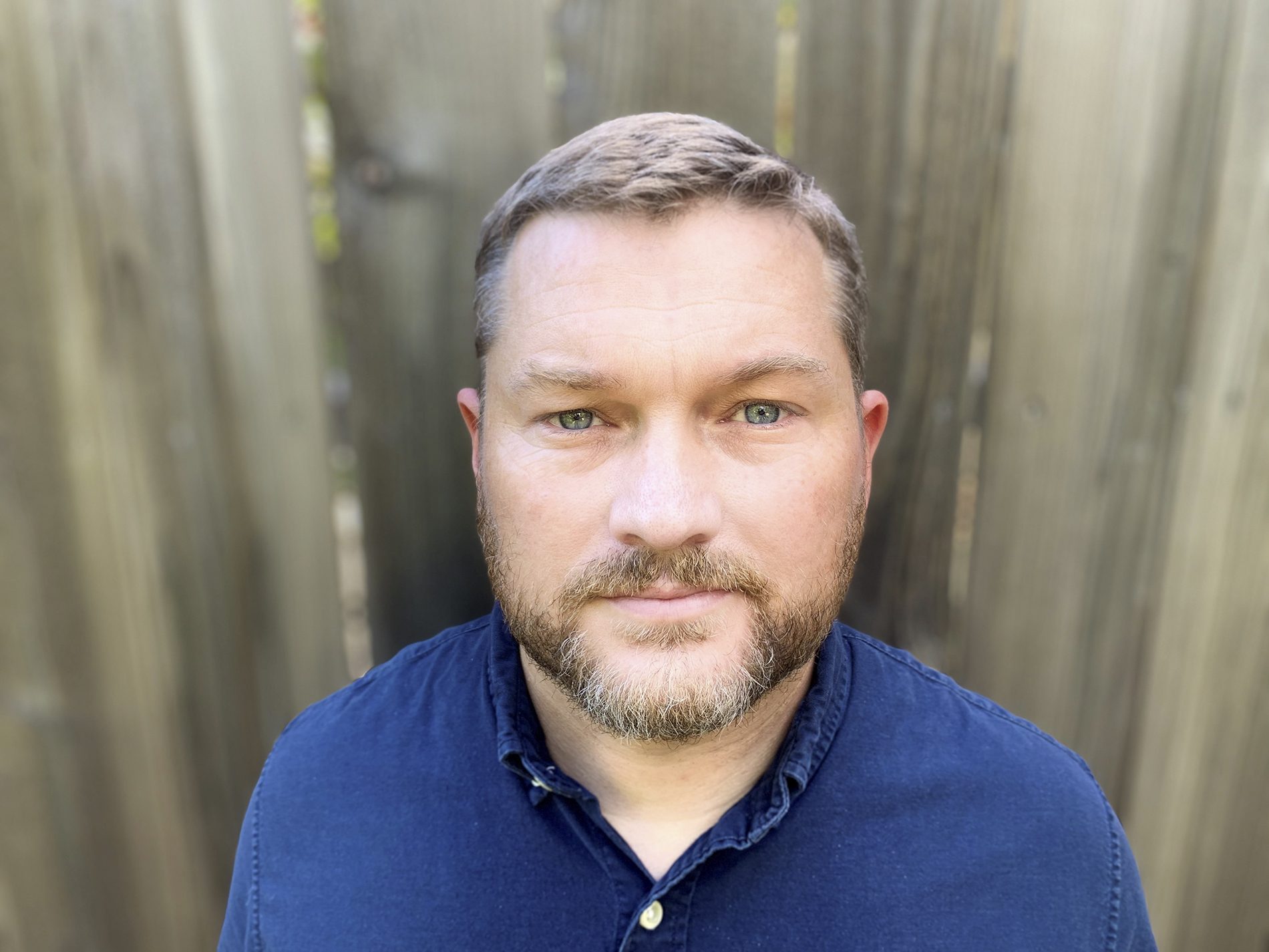 Reece Jones in blue collared shirt